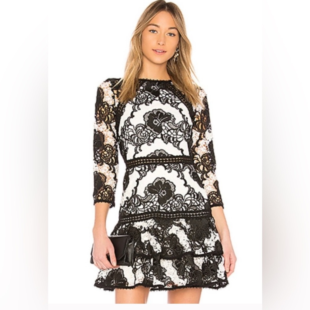 Like new Alexis black and white lace dress size medium